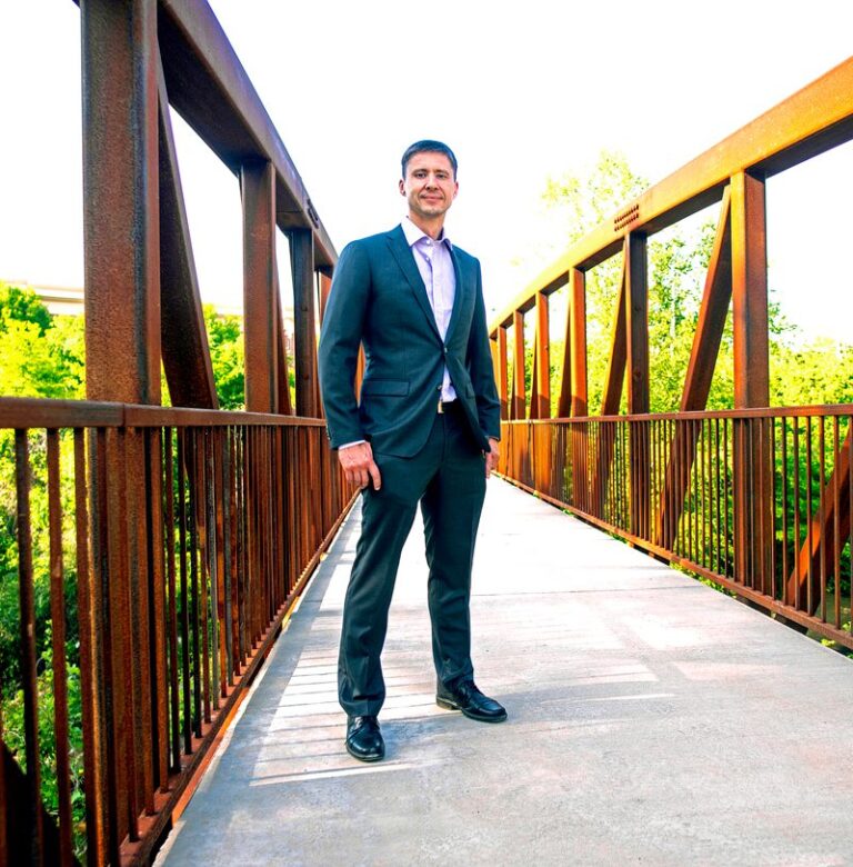 Igor Belykh standing on a footbridge in Atlanta
