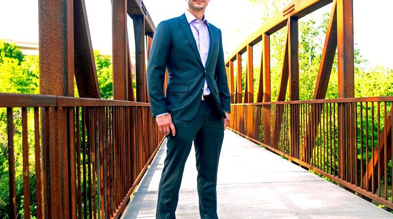 Igor Belykh standing on a footbridge in Atlanta