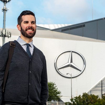 A photo of Tim Kellison in front of Mercedes-Benz Stadium