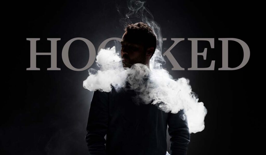 Man vaping in front of word "Hooked"