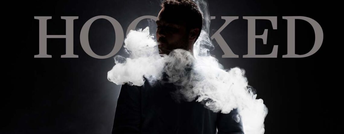 Man vaping in front of word "Hooked"